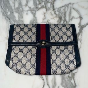 Gucci Vintage 1970s monogrammed clutch/Made in Italy GUC